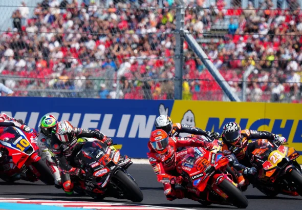 Marco Bezzecchi and Marc Marquez, with other riders, racing at the 2025 Hungary GP