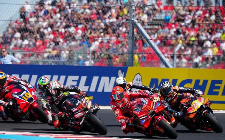 Marco Bezzecchi and Marc Marquez, with other riders, racing at the 2025 Hungary GP