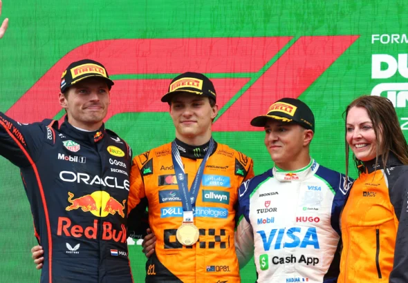 Max Verstappen, Oscar Piastri, and Isack Hadjar on the podium at F1 2025 Dutch Grand Prix