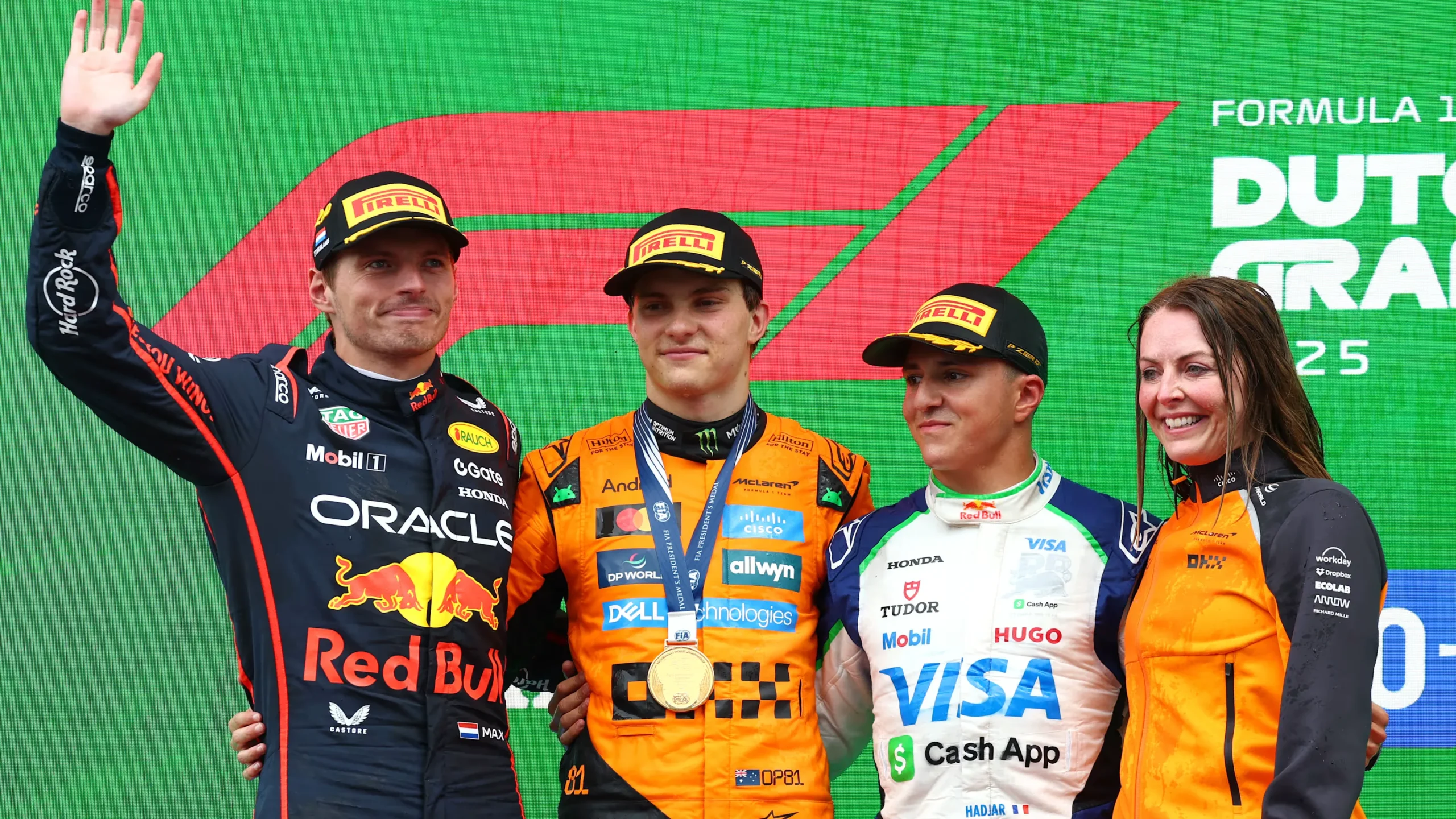 Max Verstappen, Oscar Piastri, and Isack Hadjar on the podium at F1 2025 Dutch Grand Prix
